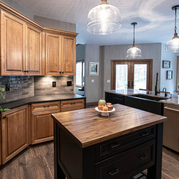 Reconfigured kitchen with new islands, countertops, backsplash