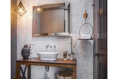 Inspiration for a small modern 3/4 black and white tile and marble tile marble floor and beige floor bathroom remodel in Los Angeles with furniture-like cabinets, distressed cabinets, a one-piece toilet, gray walls, a vessel sink and wood countertops