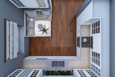 Mid-sized mountain style l-shaped medium tone wood floor and brown floor eat-in kitchen photo in London with a double-bowl sink, white cabinets, quartzite countertops, black backsplash, mosaic tile backsplash, paneled appliances and no island
