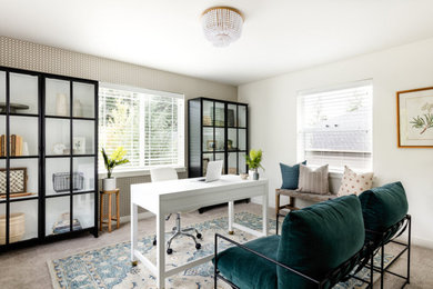 This is an example of a mid-sized contemporary study room in Seattle with white walls, carpet, no fireplace and a freestanding desk.