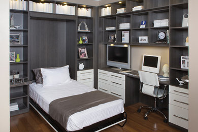 Example of a large transitional built-in desk medium tone wood floor and brown floor study room design in Tampa with beige walls