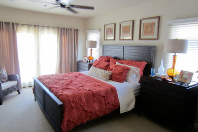 Small beach style master carpeted bedroom photo in San Diego with beige walls