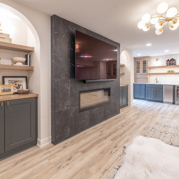 Warm & Inviting Basement Retreat with Custom Bar + Entertainment Center