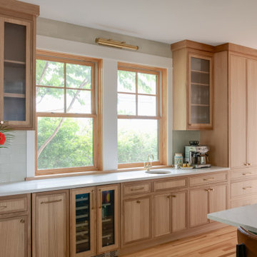 Warm Modern Kitchen Renovation with Natural Oak & Green Accents