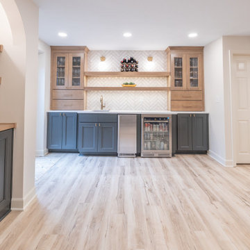 Warm & Inviting Basement Retreat with Custom Bar + Entertainment Center