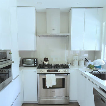 Custom White Kitchen with Back-Painted Glass Backsplash – Upper Lonsdale Renovat