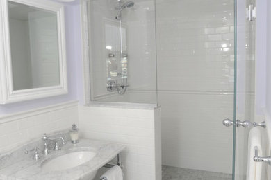 Inspiration for a white tile alcove shower remodel in Boston with a console sink