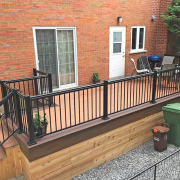 Tiki Torch Decking With Lava Rock Picture Frame and Cedar Wood Skirting