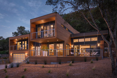 Inspiration for a contemporary two-story wood flat roof remodel in San Francisco
