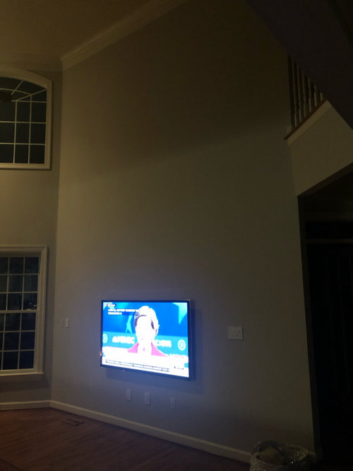 white wall space above TV