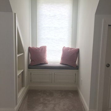 Custom built upholstered bed wall with LED lighting.