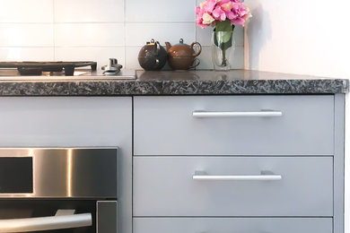 Example of a small trendy galley enclosed kitchen design in New York with no island