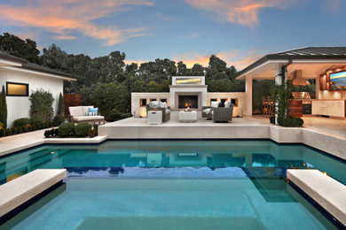 Inspiration for a mid-sized transitional pool in Orange County.