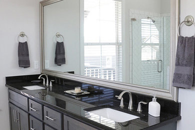 Mid-sized country master gray tile and ceramic tile ceramic tile bathroom photo in Other with shaker cabinets, gray cabinets, a one-piece toilet, gray walls, an undermount sink and granite countertops