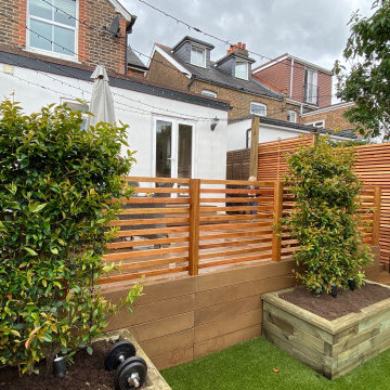 Millboard deck, artificial grass and cedar slat fencing in Reigate