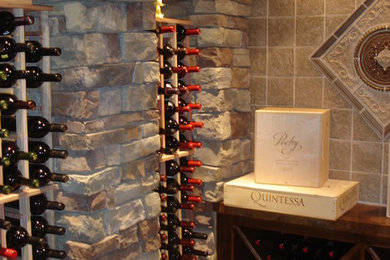Wine cellar - mediterranean wine cellar idea in Other