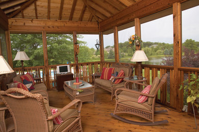 Inspiration for a mid-sized rustic medium tone wood floor and brown floor sunroom remodel in Chicago with a standard ceiling