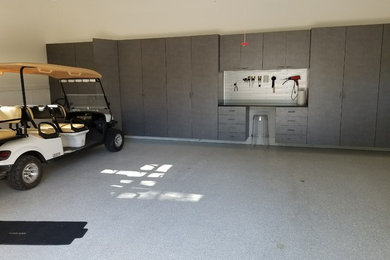 Mid-sized minimalist attached two-car garage workshop photo in Atlanta