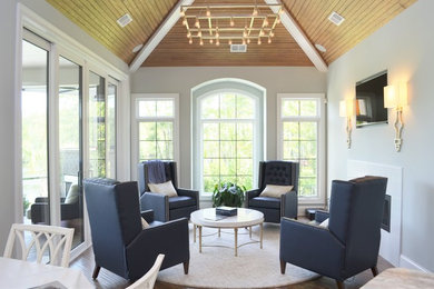 Mid-sized transitional formal and enclosed brown floor and dark wood floor living room photo in Other with a wall-mounted tv, a ribbon fireplace, white walls and a stone fireplace