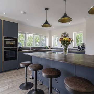 Modern Blue Kitchen with Mettalic Accents in Granborough