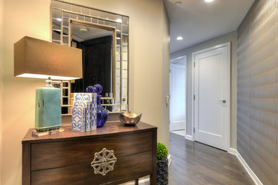 Entryway - mid-sized transitional medium tone wood floor entryway idea in Austin with gray walls