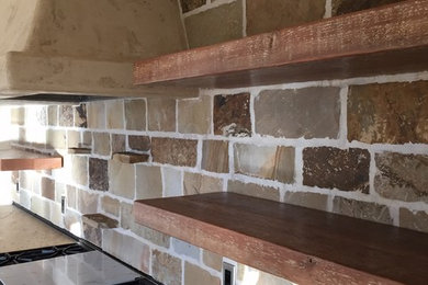 Mid-sized farmhouse medium tone wood floor enclosed kitchen photo in Other with an undermount sink, shaker cabinets, dark wood cabinets, granite countertops, beige backsplash, brick backsplash, stainless steel appliances and an island