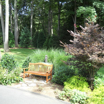 Plantings and a bench hide the transformer