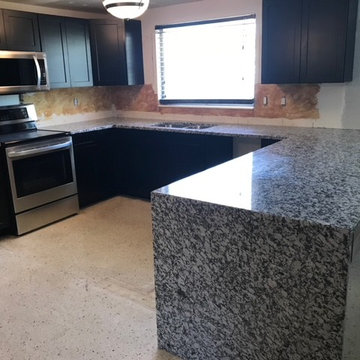 White Fioritto Granite Kitchen with Waterfall Leg