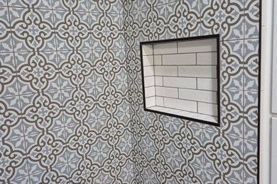 Bathroom - mid-sized farmhouse ceramic tile and single-sink bathroom idea in Other with shaker cabinets and quartz countertops