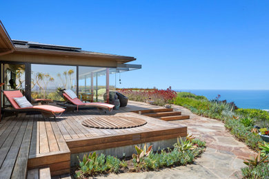 Deck - modern backyard ground level deck idea in San Diego