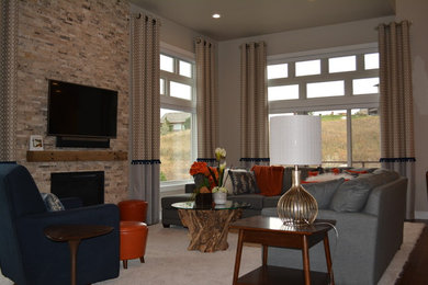 Mid-sized transitional formal and open concept dark wood floor and brown floor living room photo in Other with beige walls, a standard fireplace, a stone fireplace and a wall-mounted tv