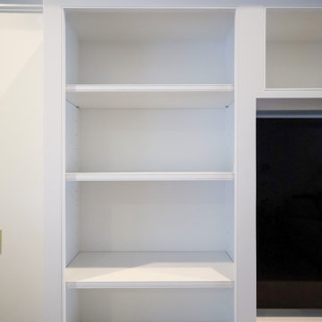 Statement-Making Living Room: Custom White Built-In Entertainment Center with Op