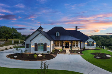 Inspiration for a french country exterior home remodel in Austin