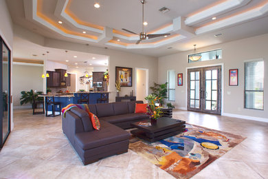 Large trendy formal and enclosed travertine floor and beige floor living room photo in Orlando with beige walls, a ribbon fireplace, a metal fireplace and a wall-mounted tv