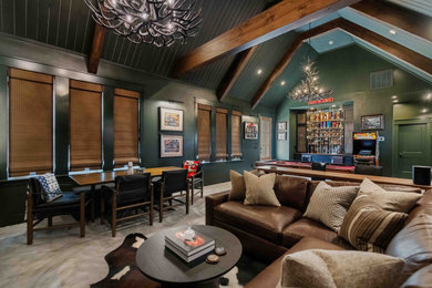 Example of a mountain style concrete floor home theater design in Other with green walls