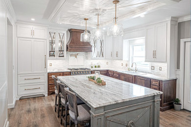 Large beach style l-shaped vinyl floor, multicolored floor and coffered ceiling eat-in kitchen photo in Other with an undermount sink, flat-panel cabinets, granite countertops, multicolored backsplash, glass sheet backsplash, paneled appliances, an island and multicolored countertops