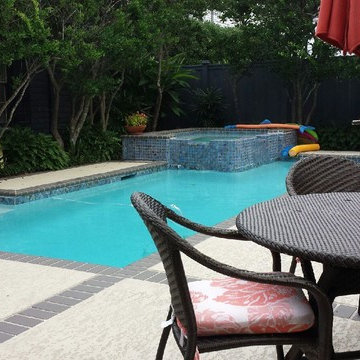 Pool, waterfall, and landscaping