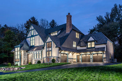 Large three-story concrete fiberboard and shingle house exterior idea in Philadelphia