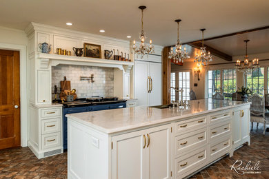 Example of a large french country galley eat-in kitchen design in Orlando with a farmhouse sink