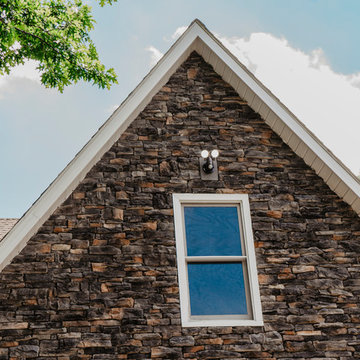 Dutch Lap Seamless Siding with Stone Accents