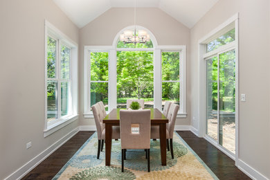 Inspiration for a small transitional dark wood floor and brown floor great room remodel in Chicago with beige walls and no fireplace