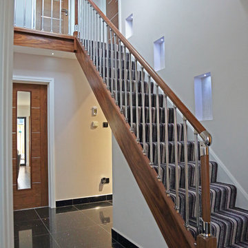 Walnut Staircase with Chrome Spindles and Recesses in Wall