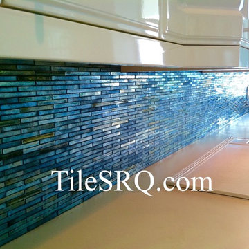 Hand made glass mosaic tiles with a iridescent coating.