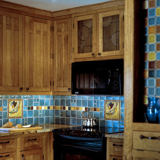 Mid-sized craftsman kitchen pantry photos - Mid-sized arts and crafts u-shaped ceramic floor and multicolored floor kitchen pantry photo in Detroit with a double-bowl sink, shaker cabinets, brown cabinets, granite countertops, blue backsplash, ceramic backsplash, black appliances, a peninsula and beige countertops