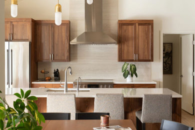 Trendy exposed beam kitchen photo in Portland with shaker cabinets, medium tone wood cabinets and quartz countertops