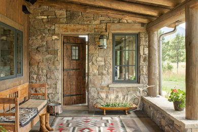 Mountain style entryway photo in Other with a medium wood front door