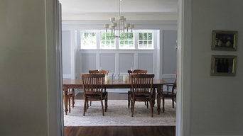 Dining room with painted wood paneling