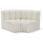 Meridian Furniture - Arc Vegan Leather Upholstered 2-Pc. Inward Curved Modular Sectional, Cream - Unleash modern opulence with the Arc Vegan Leather 2pc. Sectional. Crafted for the modern connoisseur, this Sectional injects an air of refined luxury into any space. Its sleek silhouette, upholstered in supple cream vegan leather, exudes timeless sophistication while the deep channel tufting adds textural intrigue, further elevating the chair's visual appeal. The modular design makes it a versatile chameleon, effortlessly adapting to your evolving needs and preferences. Whether you envision it gracing a chic living room corner, basking in the glow of a bedroom window, or adding a touch of drama to a home office, the Arc seamlessly complements your unique interior aesthetic.