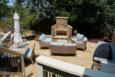 Inspiration for a large rustic backyard patio remodel in Atlanta with a fireplace