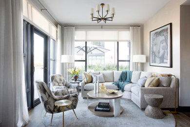 Inspiration for a contemporary dark wood floor and brown floor living room remodel in Charleston with beige walls